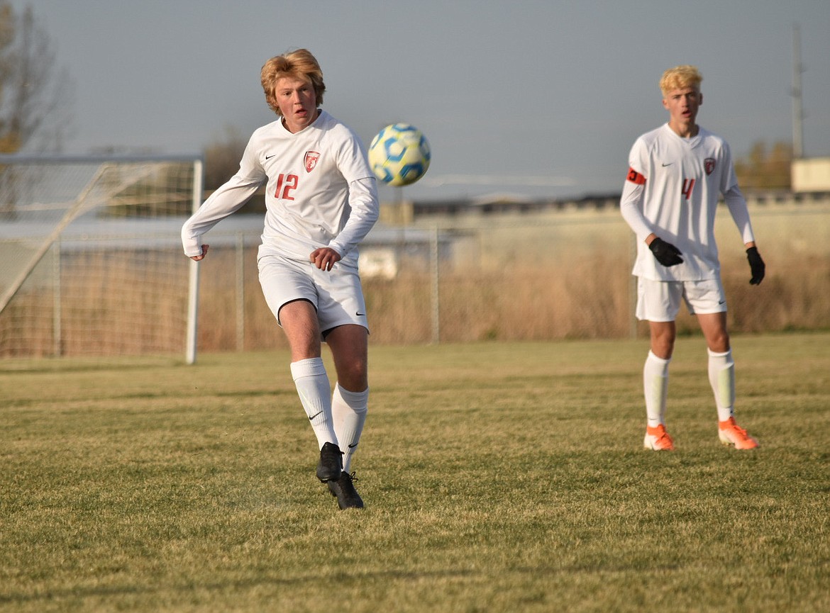 Senior defender Kris Berget kicks the ball during Friday's state match.