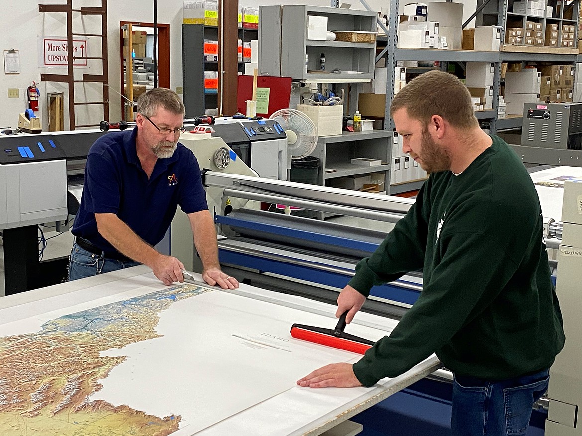 Darryl Frey and Carl Carter, wide format technicians for the digital color division of Allegra Marketing-Print-Mail in Coeur d'Alene, are two reasons the company keeps busy even when political season ends.