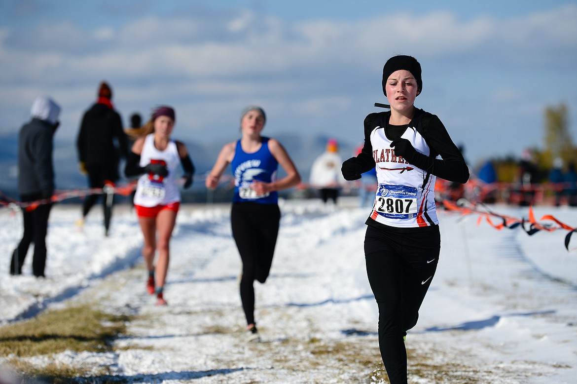 Flathead's Lilli Rumsey Eash runs the course at the Class AA girls' state meet at Rebecca Farm on Saturday. Rumsey Eash placed seventh. (Casey Kreider/Daily Inter Lake)