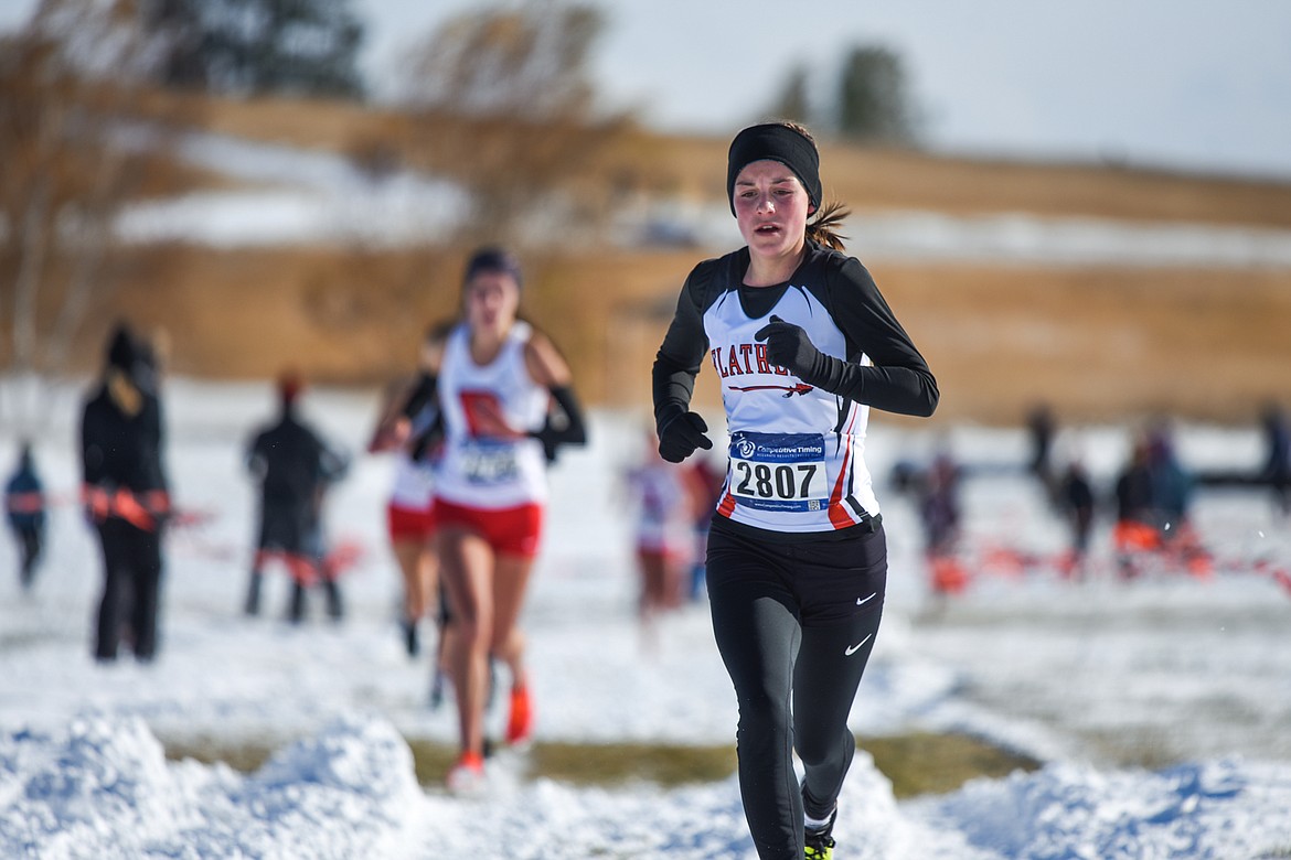 Flathead's Lilli Rumsey Eash runs the course at the Class AA girls' state meet at Rebecca Farm on Saturday. Rumsey Eash placed seventh. (Casey Kreider/Daily Inter Lake)