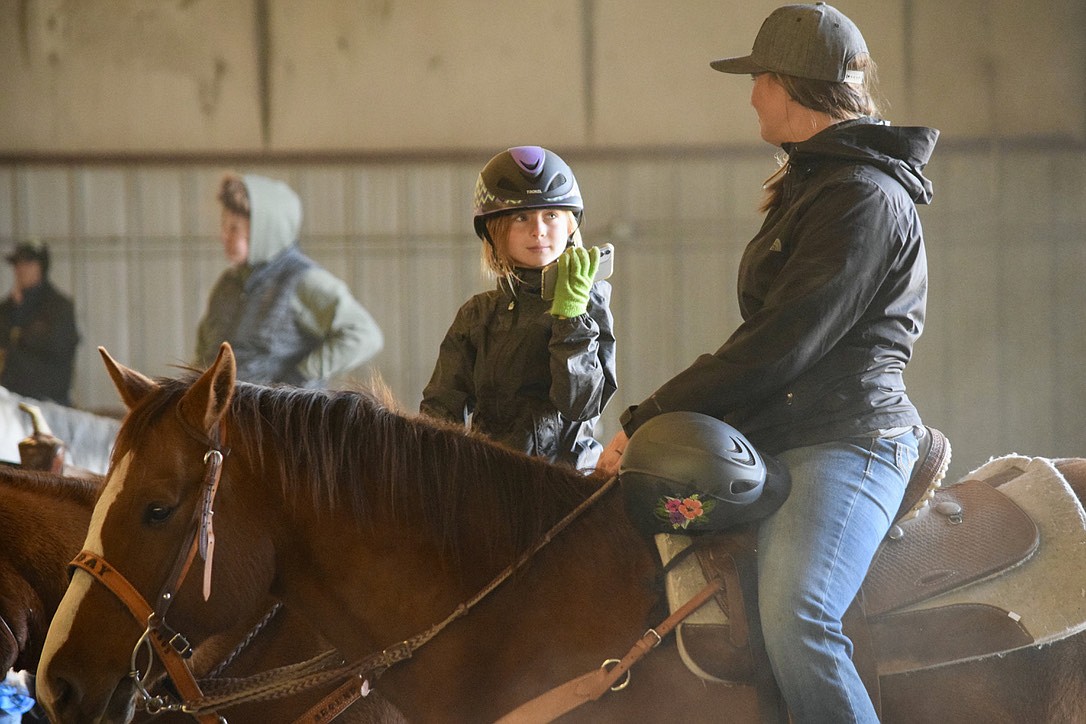 A pair of riders wait to compete the Columbia Basin Barrel Racing Club's winter finals at the Grant County Fairgrounds on Saturday.