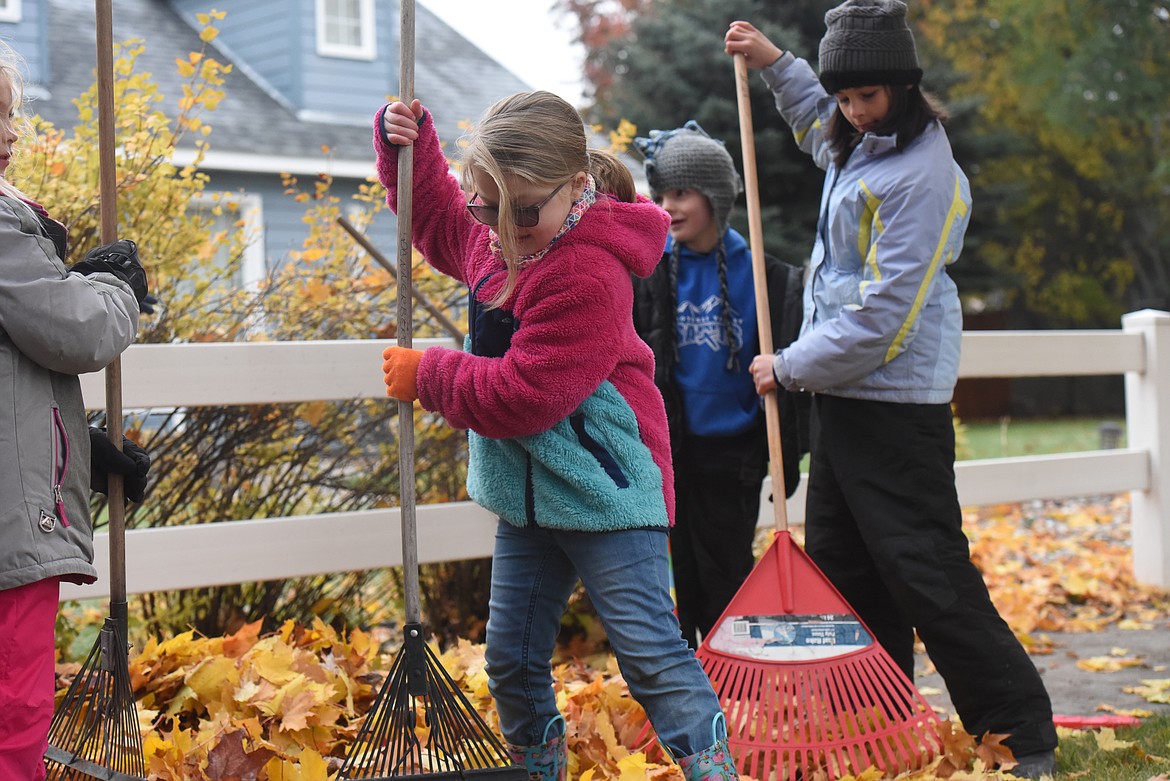 Kootenai Valley Christian School second graders rake leaves as part of an Oct. 23 rake-a-thon.
KVCS students raked yards throughout Libby to raise money for the school just before Friday's snow storm.
