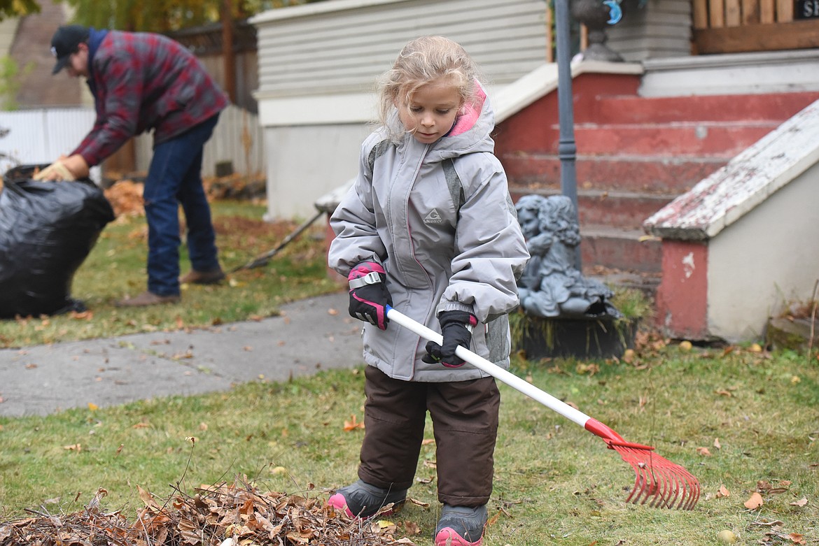 Maddie O'Neal, a first grader at Kootenai Valley Christian School, rakes leaves as part of an Oct. 23 rake-a-thon. KVCS students raked yards throughout Libby to raise money for the school.