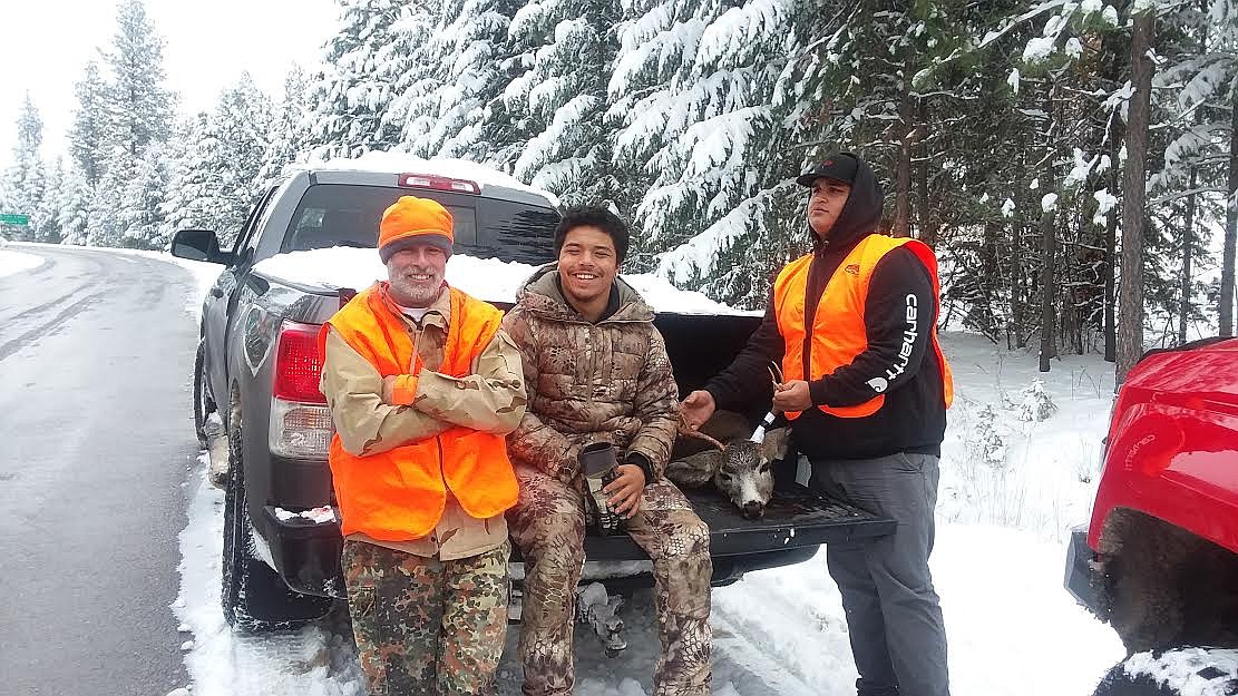 From left, are Clay Hall, Orion Pry-Hyde and A.J. Sandoval at the Fish Creek Game Check Station last Saturday with Sandoval’s first mule deer buck. Saturday was the first day of the general hunting season for elk and deer. (Monte Turner/Mineral Independent)