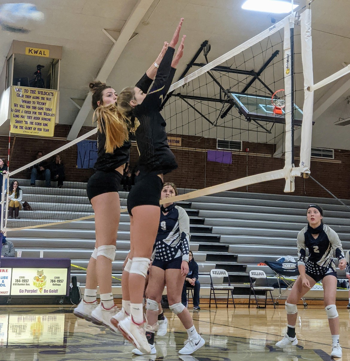 Kellogg's Hailey Cheney and Grace Nearing rise up for a block during their district semifinal win over Bonners Ferry.