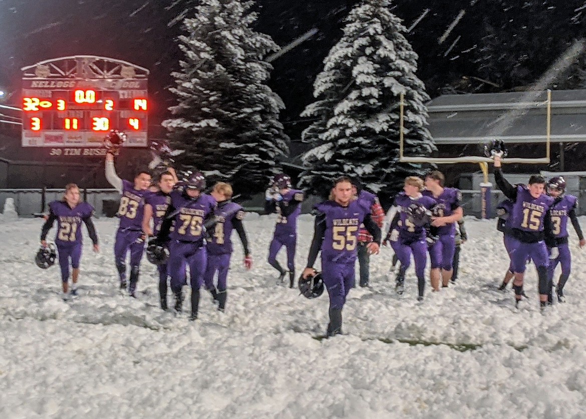 The victorious Wildcats walk off the field with a helmet salute to their opponents from Bonners Ferry.