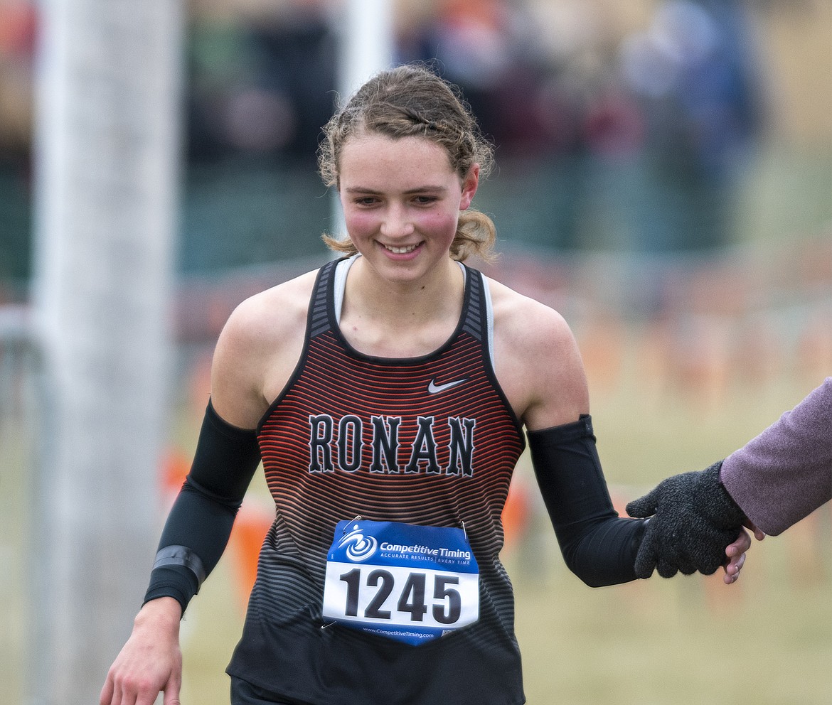 Olivia Heiner of Ronan cracks a smile during the Class A state meet Friday in Kalispell (Chris Peterson/Hungry Horse News)