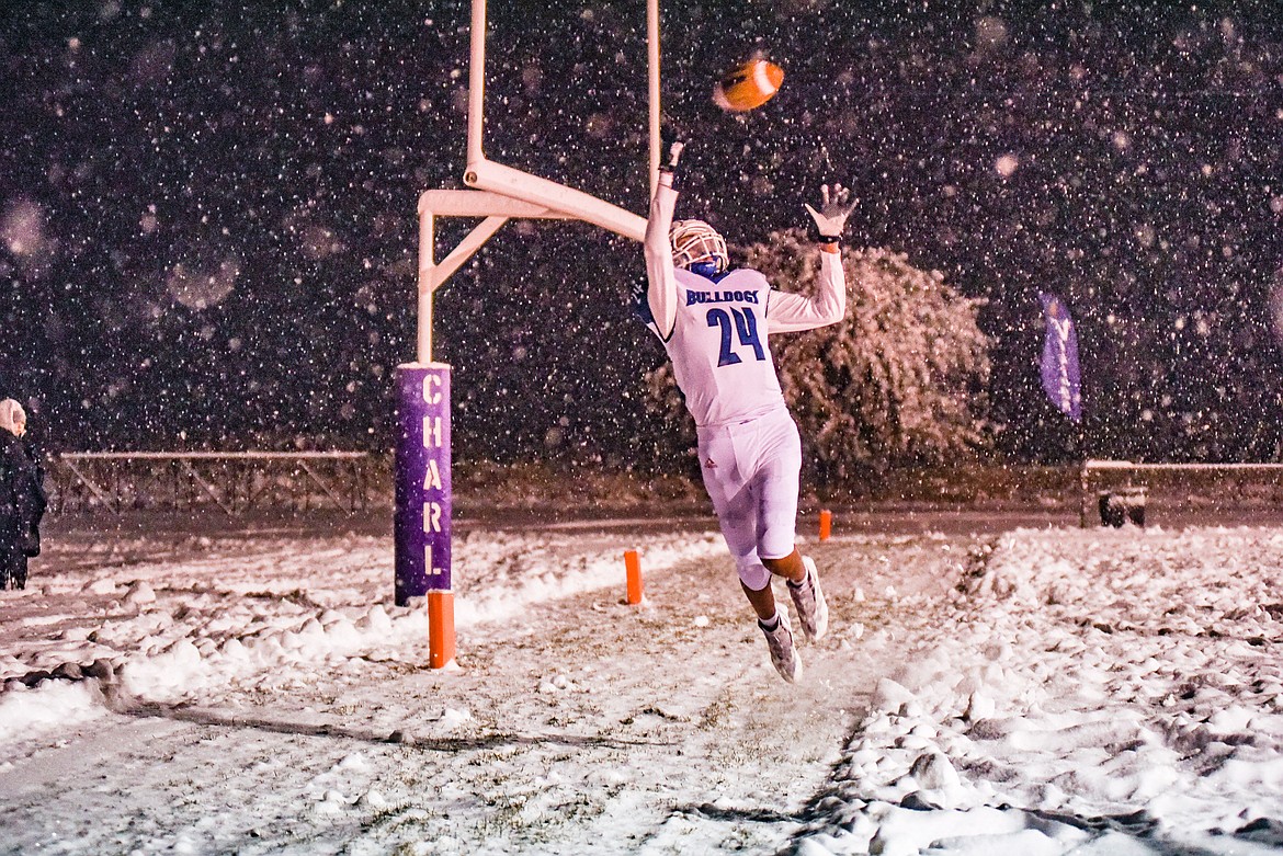 Mission's Cedrick McDonald goes up for the ball in the end zone. (Christa Umphrey)