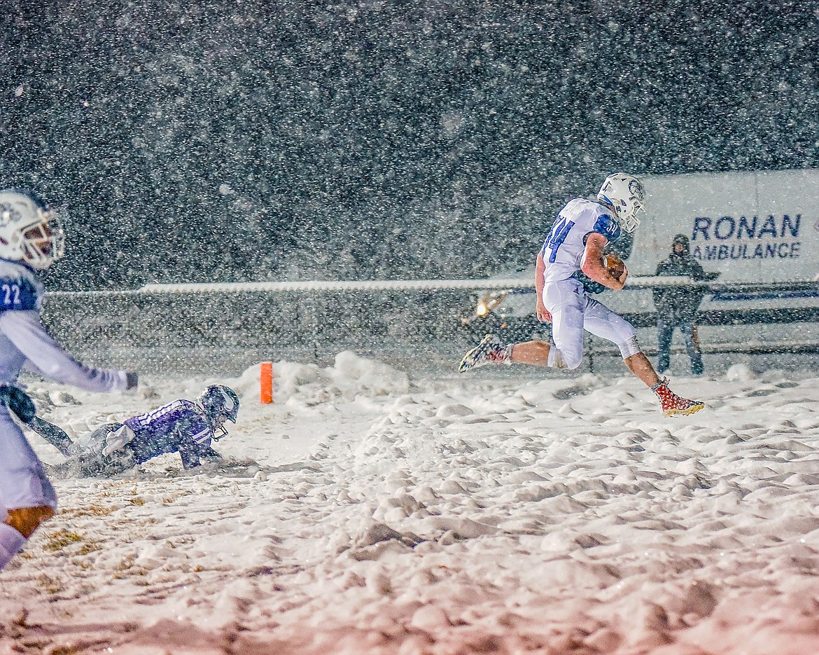 Layne Spidel crosses the goal line for a Mission touchdown. (Christa Umphrey)