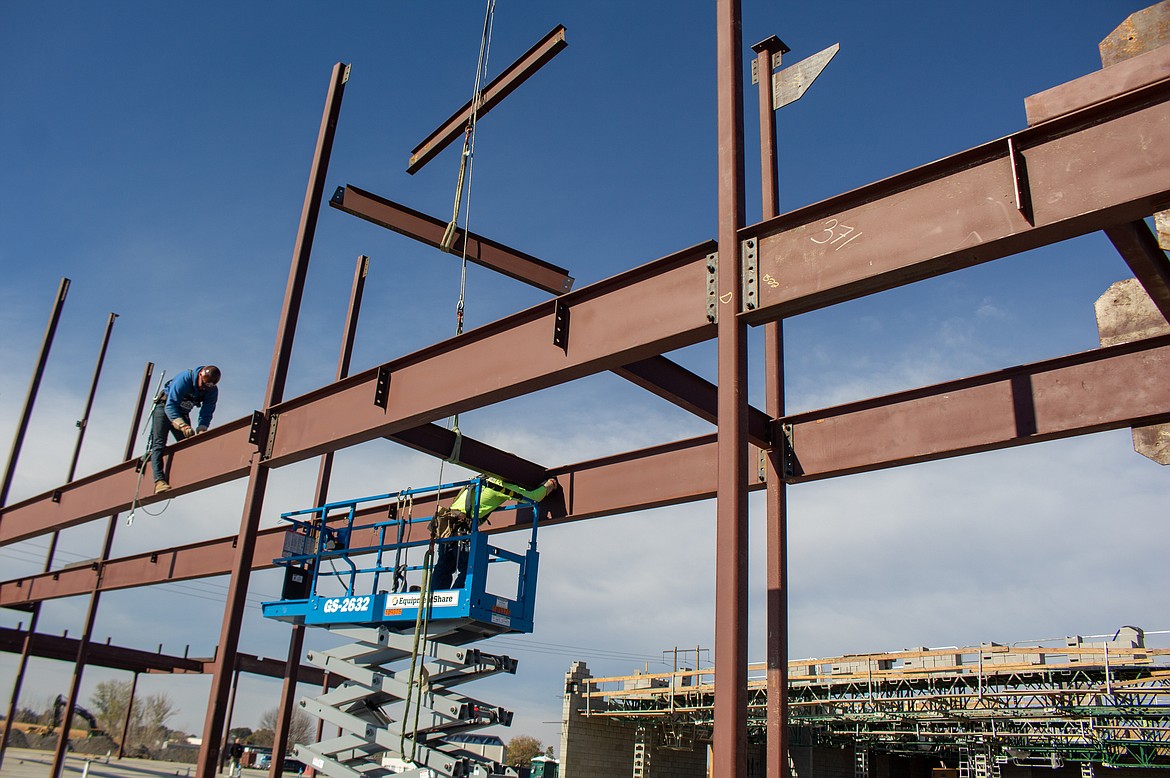 Construction crew secure steel beams in place as the frame of the new Vicki Groff Elementary School continues to take shape in Moses Lake on Tuesday.