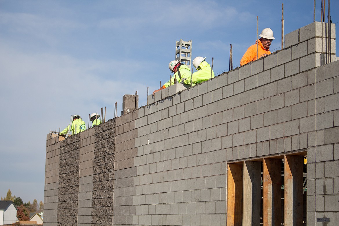 Bricks are laid in place on Tuesday as construction continues on the new Vicki Groff Elementary School in Moses Lake.