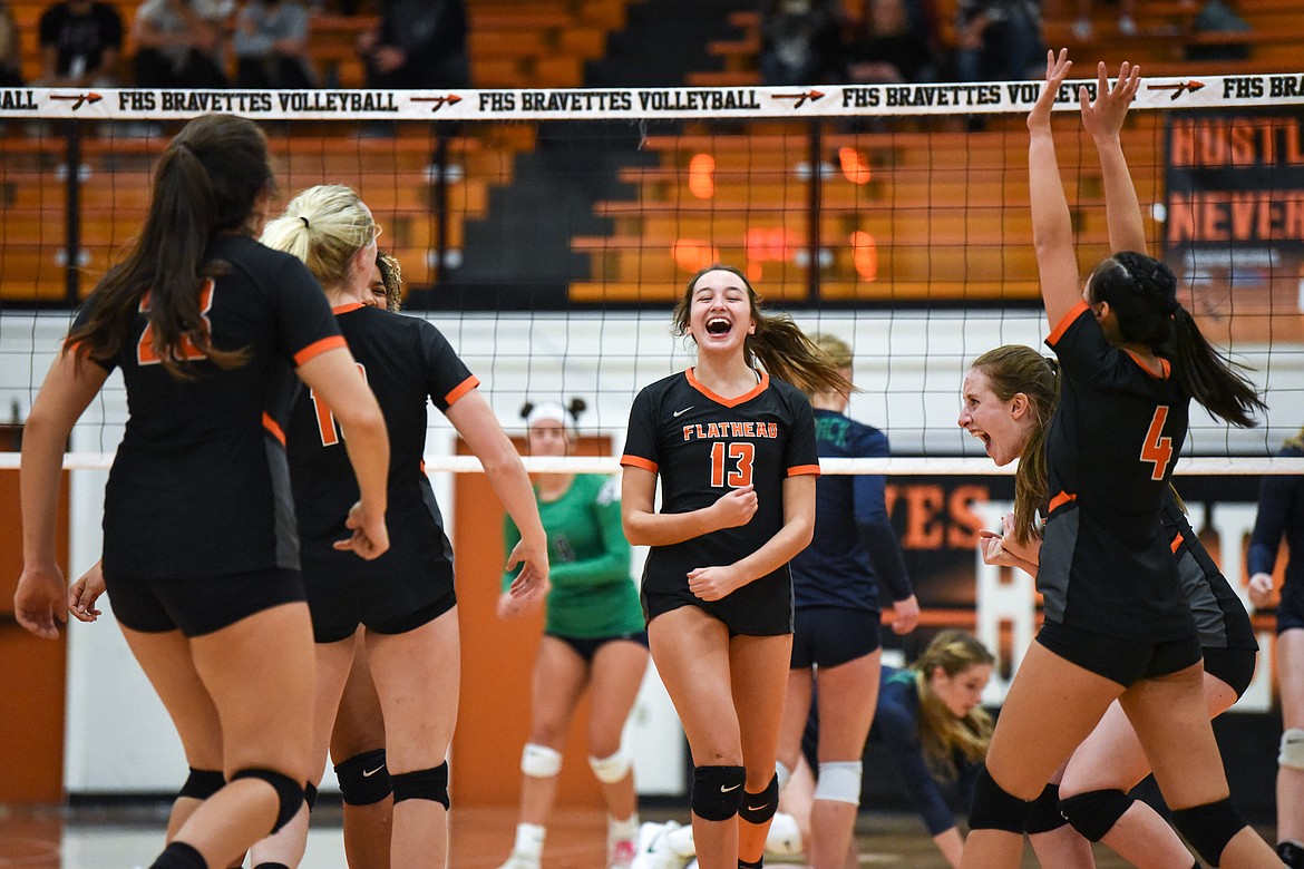 Flathead's Maddi Chavez (13) celebrates with fellow Bravettes after a point against Glacier during crosstown volleyball at Flathead High School on Tuesday. (Casey Kreider/Daily Inter Lake)