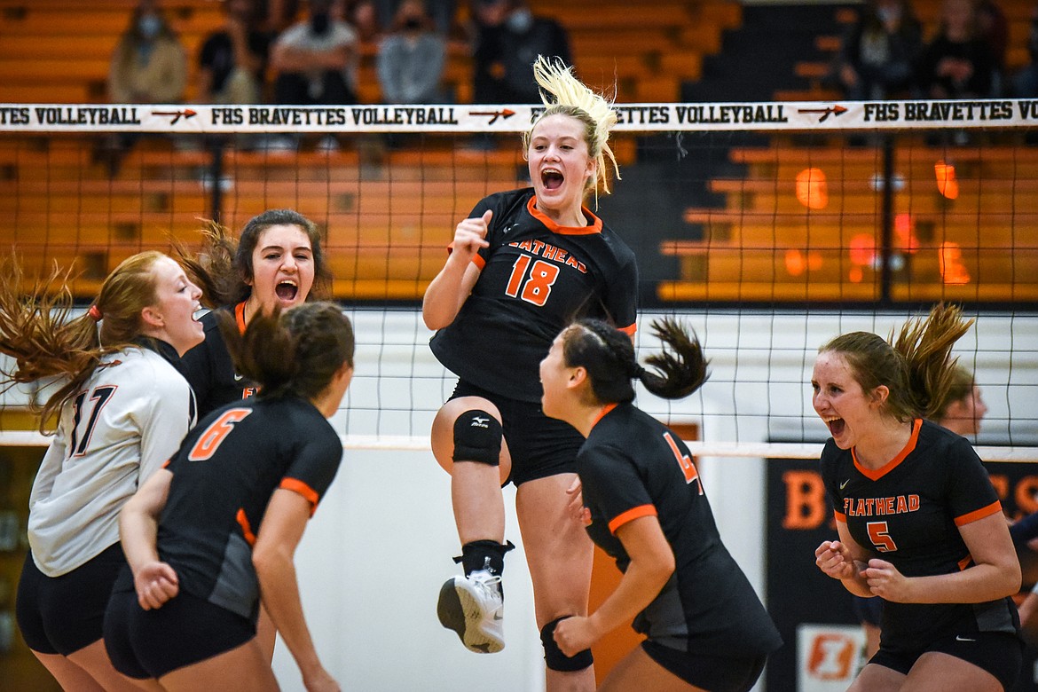 Flathead's Madelyn Moy (18) celebrates with fellow Bravettes after a point against Glacier during crosstown volleyball at Flathead High School on Tuesday. (Casey Kreider/Daily Inter Lake)