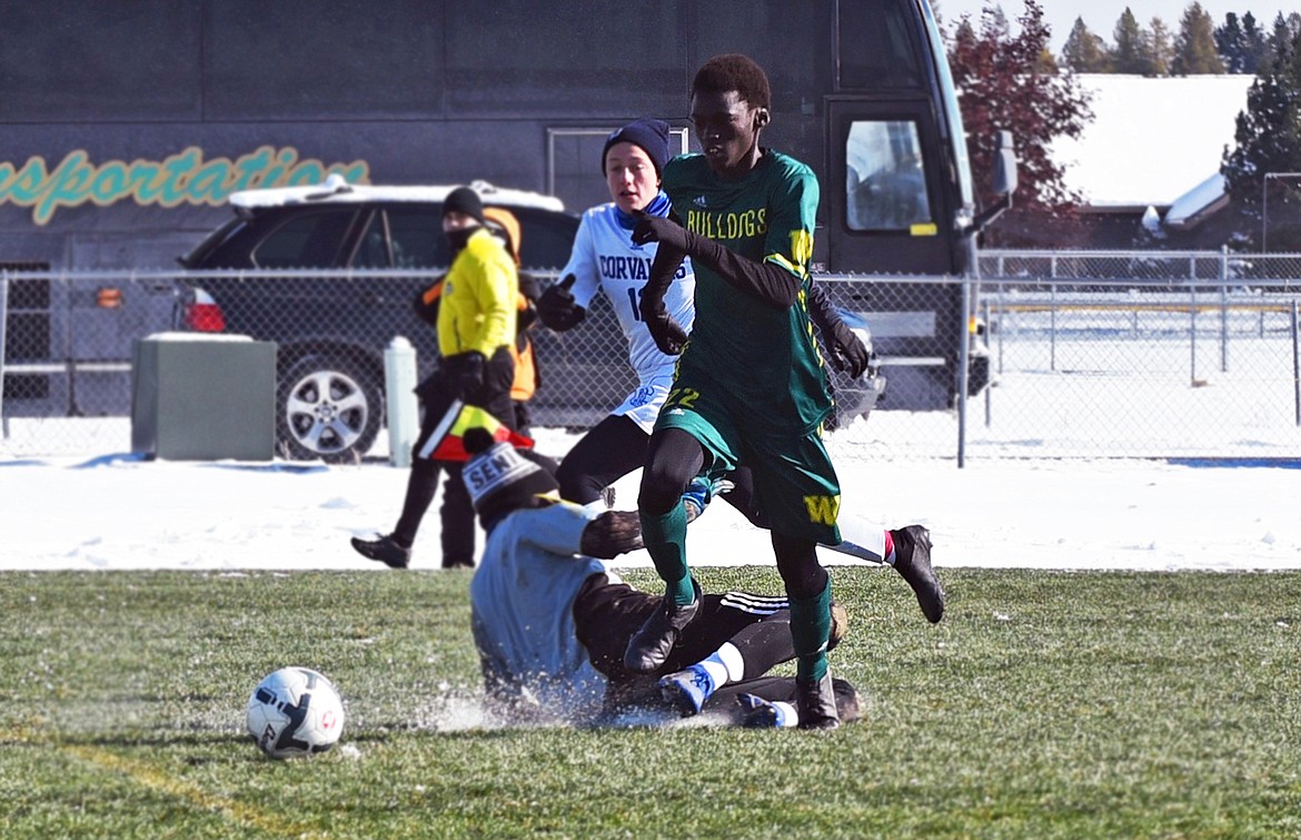 Whitefish senior Marvin Kimera beats Corvallis' goalkeeper on his way to scoring in the second half of a Class A semifinal Saturday at Smith Fields. (Whitney England/Whitefish Pilot)