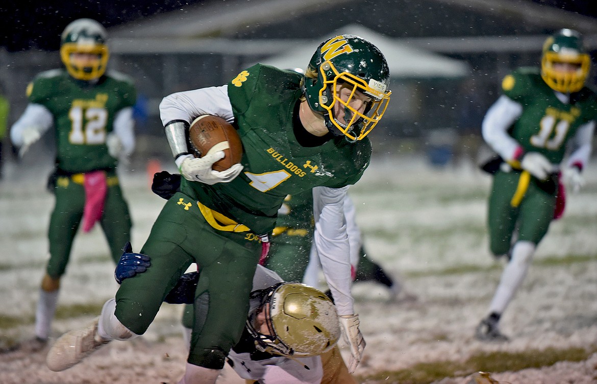 Bulldog Jaxsen Schlauch picks up additional yardage after making a catch  in a game against Dillon Friday night at the Dog Pound. (Whitney England/Whitefish Pilot)