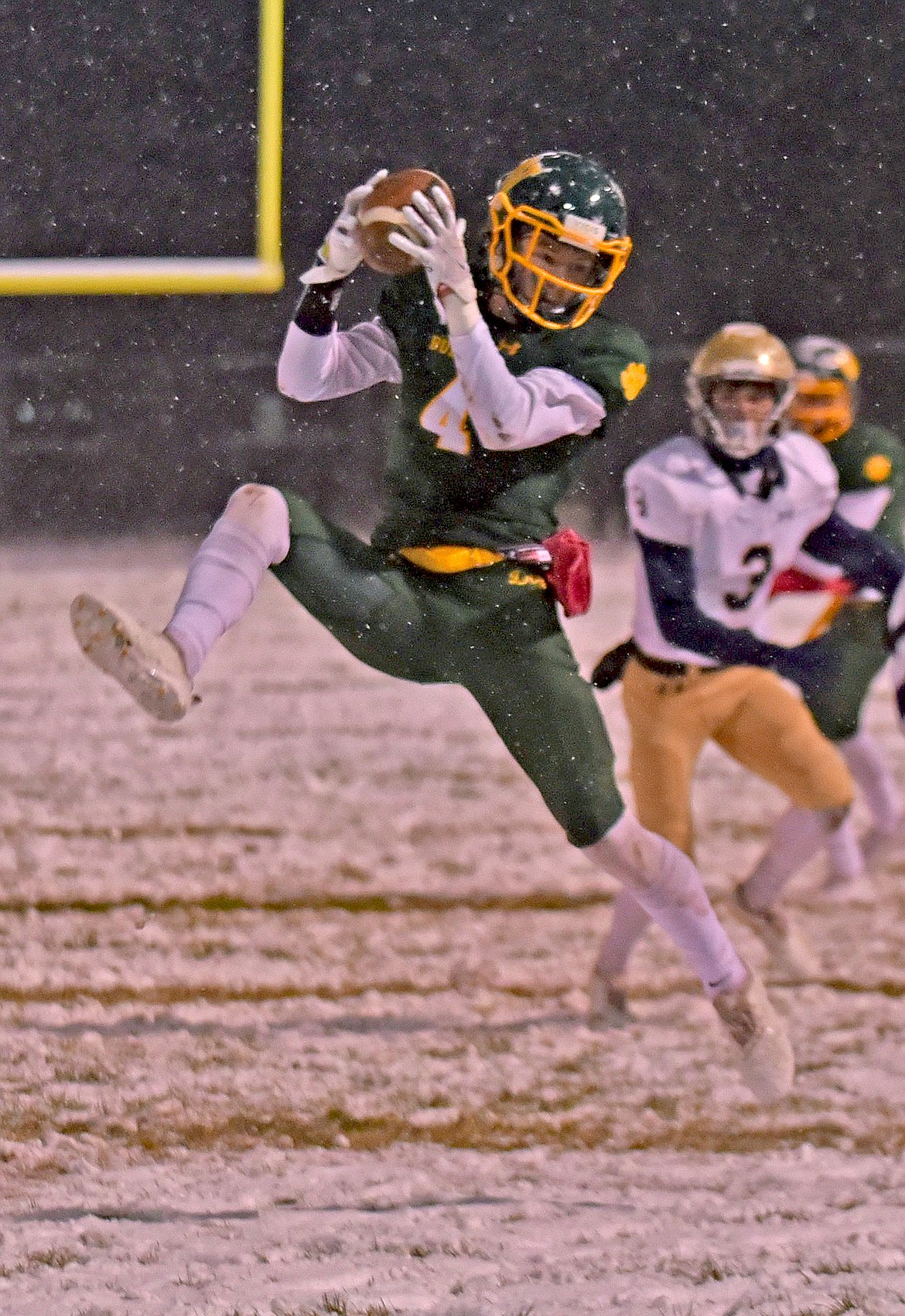 Whitefish receiver Jaxsen Schlauch makes a big catch on his way to recording 149 receiving yards in a game against Dillon Friday night at the Dog Pound. (Whitney England/Whitefish Pilot)