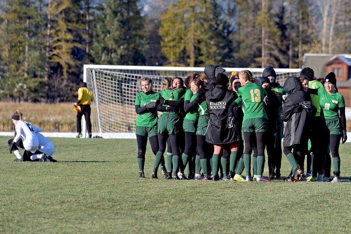 The Whitefish girls soccer team celebrates their 1-0 win over Billings Central in the Montana Class A semifinals Saturday at Smith Fields. (Whitney England/Whitefish Pilot)