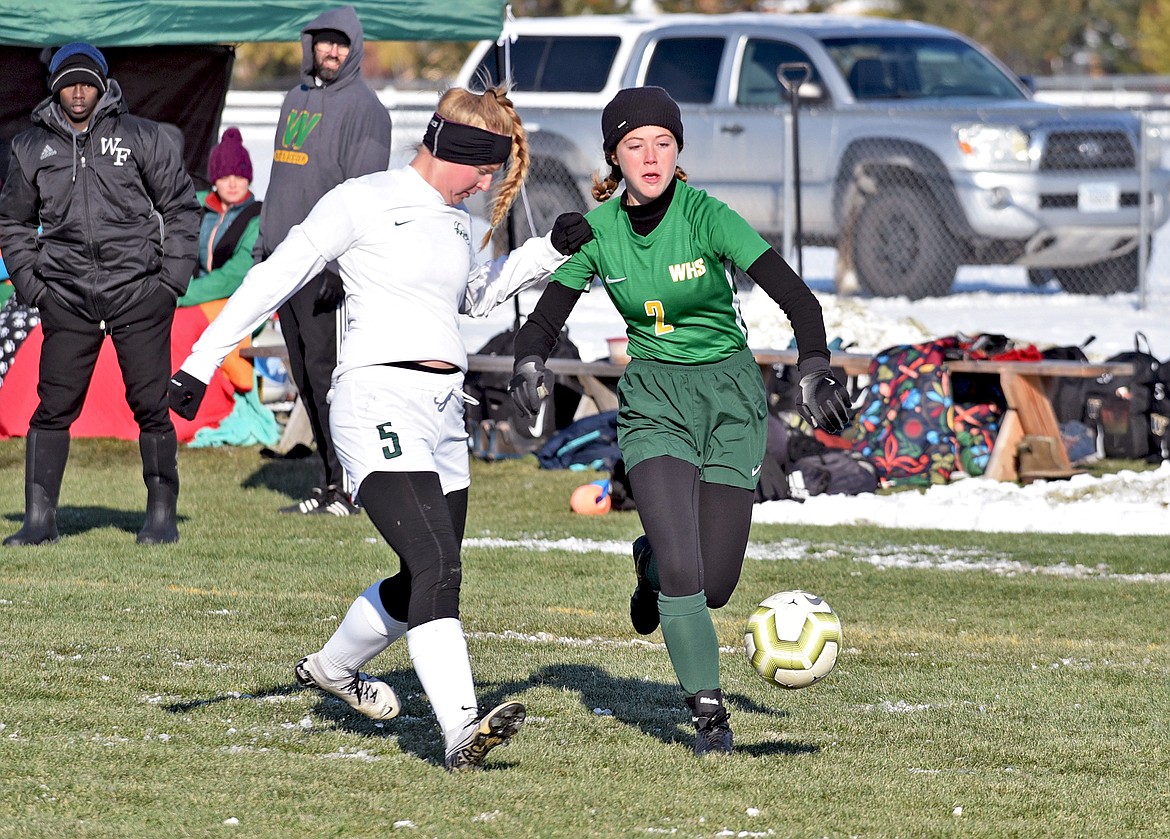Whitefish's Brooke Roberts takes the ball down the line in a Class A semifinal game against Billings Central Saturday at Smith Fields. (Whitney England/Whitefish Pilot)