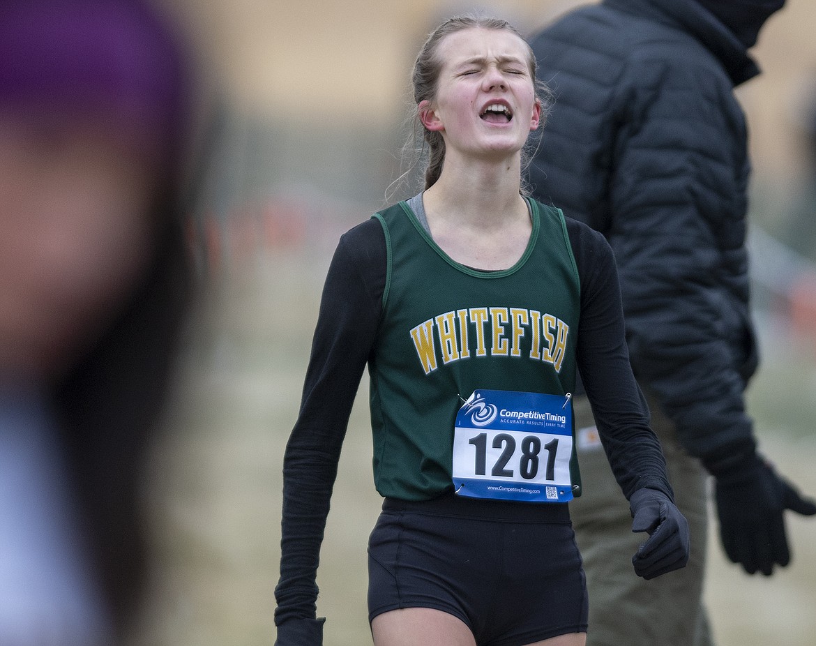 Paetra Cooke reacts after crossing the finish line at the state A championship meet at Rebecca Farm Friday. (Chris Peterson photo)