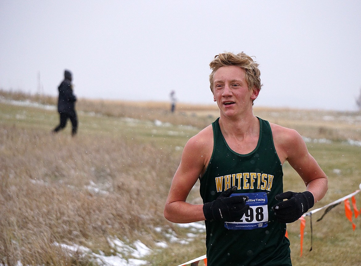 Running with snow falling, Bulldog Ruedi Steiner finished at the state Class A championship on Friday at Rebecca Farm with a time of 17:59.96. (Matt Weller photo)