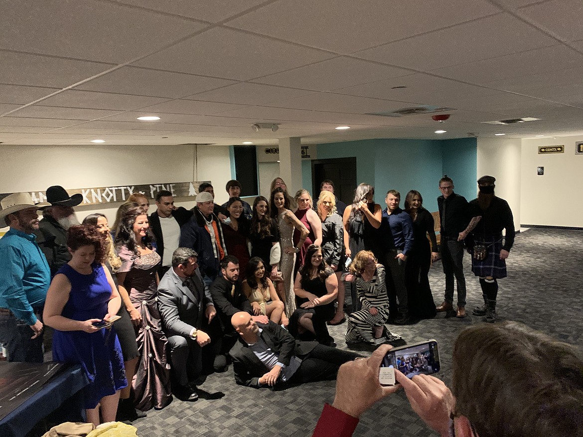 Members of the cast and crew of "Nexus of Evil," a homegrown horror film by Polson-based Second Wind Productions, pose for a group photo Thursday night during the film's premiere party at Showboat Stadium 6. (Scot Heisel/Lake County Leader)