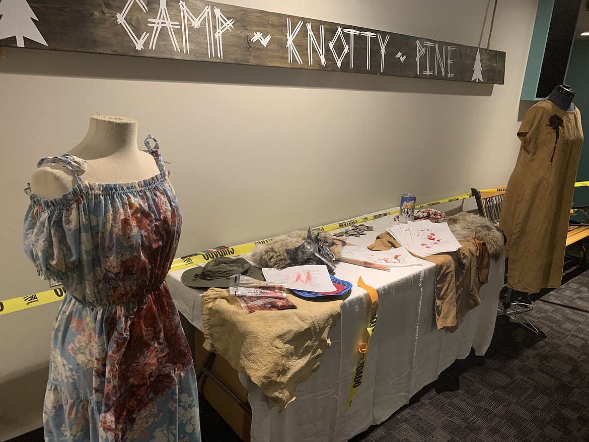 A table lined with memorabilia from the set of "Nexus of Evil" was arranged in the lobby of Showboat Stadium 6 on Thursday night during the film's premiere party. (Scot Heisel/Lake County Leader)