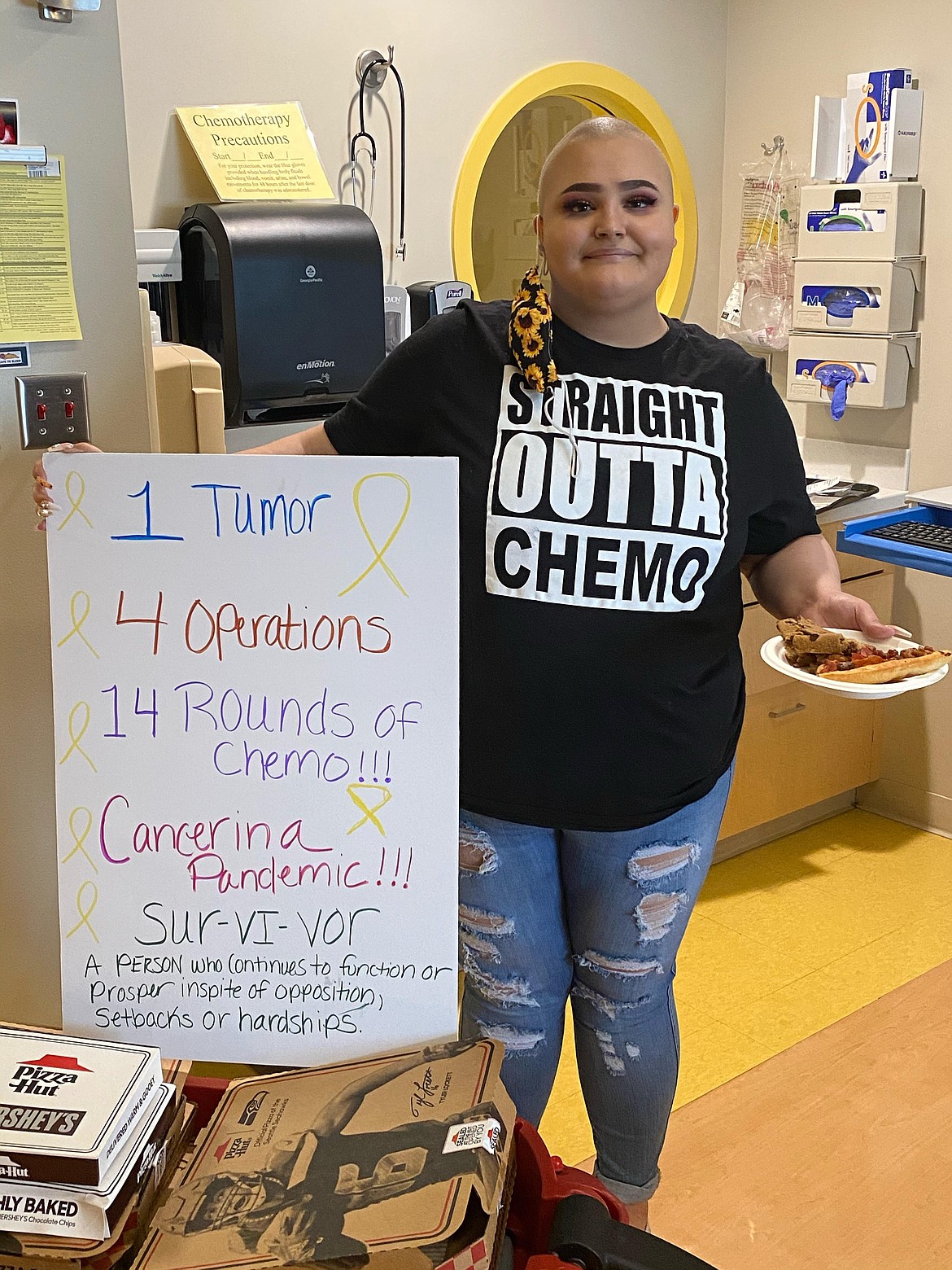The sign says it all as Avree Pruneda of Warden poses for a photo after wrapping up her final round of chemotherapy in Spokane last week.
