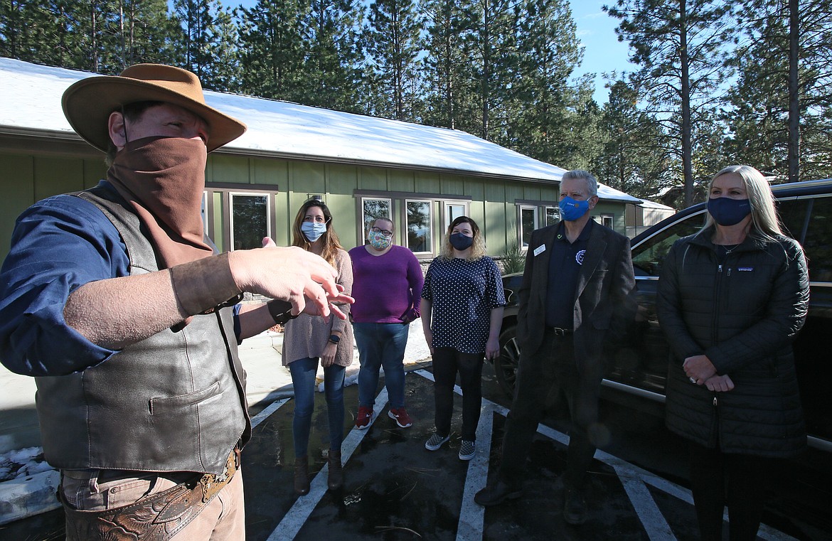 Silverwood's Marshal Jack, played by Chris Tortora, left, on Wednesday explains how he and his team navigated good guys and outlaws wearing masks aboard the Steam Train No. 7 amid the COVID-19 pandemic. Silverwood donated $50,000 to Children's Village. The money was collected from passengers during train "robberies" this season.