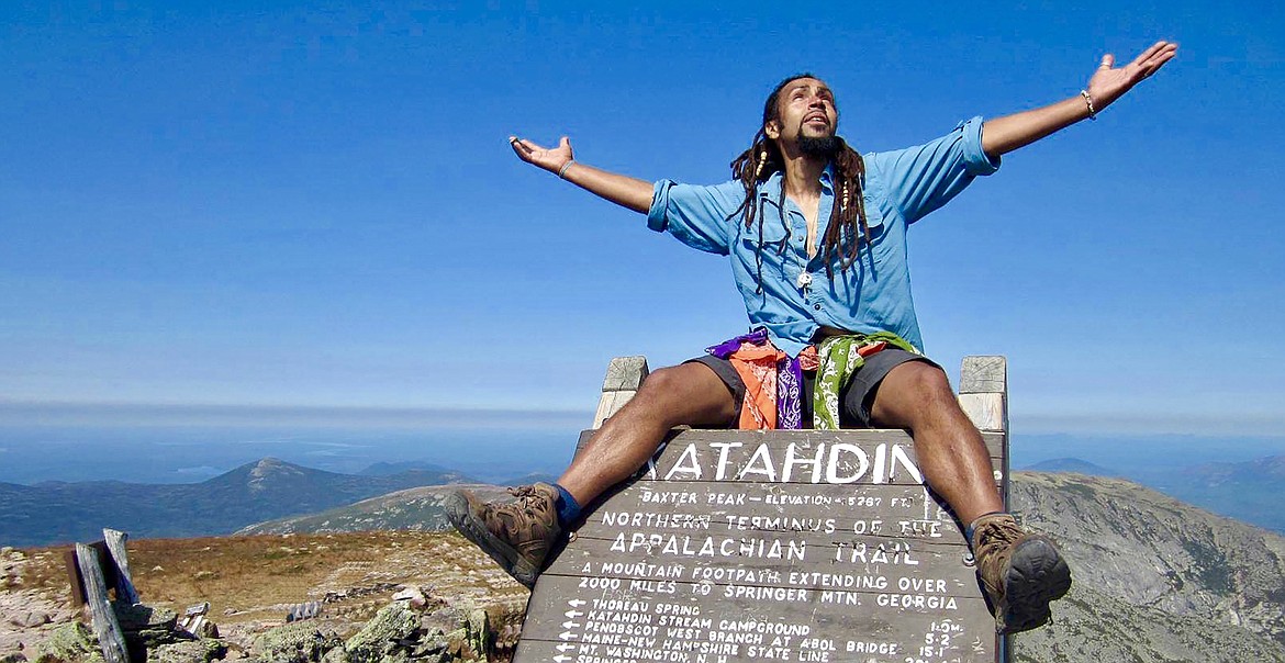 Derick Lugo, author of “The Unlikely Thru-Hiker,” hangs out on the trail