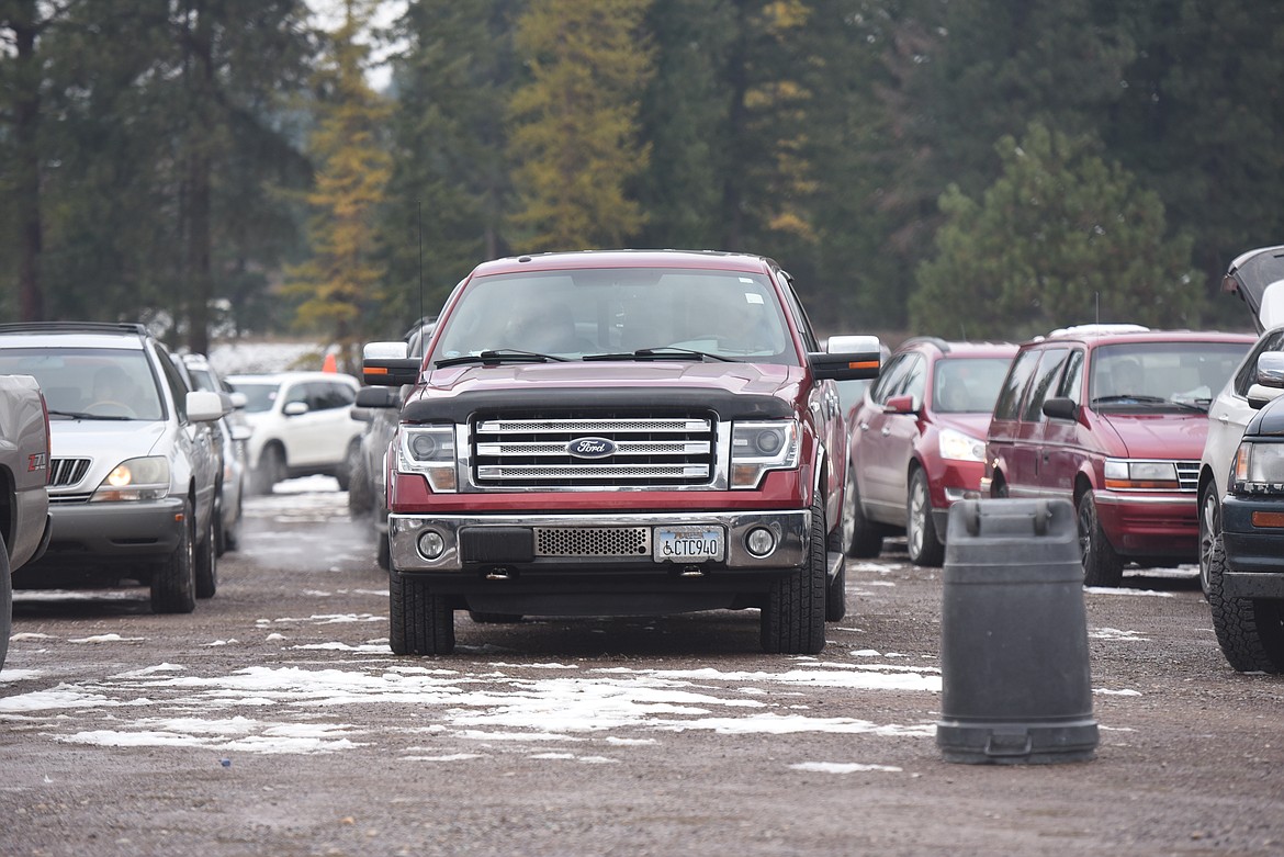 Drivers wait at the Libby Assembly of God parking lot to pick meals at an Oct. 28 Lincoln County Food Box Distribution event.