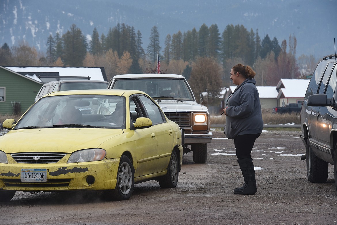 Kayla Dupert directs cars at an Oct. 28 Lincoln County Food Box Distribution event.