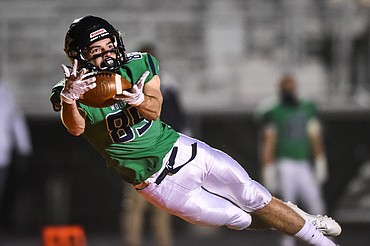 Glacier wide receiver Mason Naomi (85) holds on to a 25-yard touchdown reception in the second quarter against Missoula Big Sky at Legends Stadium on Friday. (Casey Kreider/Daily Inter Lake)