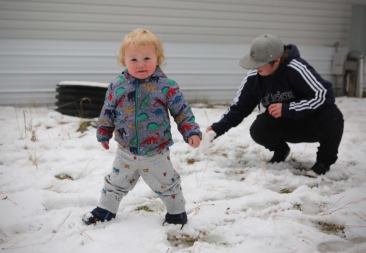 Makynzie Kurns' son Graycen, 1, plays in the snow in the front yard of their mobile home.
Mackenzie Reiss/Daily Inter Lake