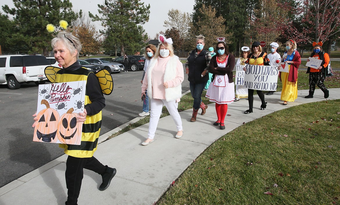 Silver Angels for the Elderly volunteers parade at the Renaissance at Coeur d'Alene senior living community Friday afternoon to bring joy to the seniors, who have been isolated during the pandemic.