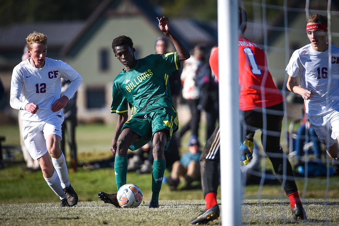 Whitefish's Marvin Kimera (22) looks to shoot against Columbia Falls during the Class A boys soccer championship at Smith Fields in Whitefish on Saturday. (Casey Kreider/Daily Inter Lake)