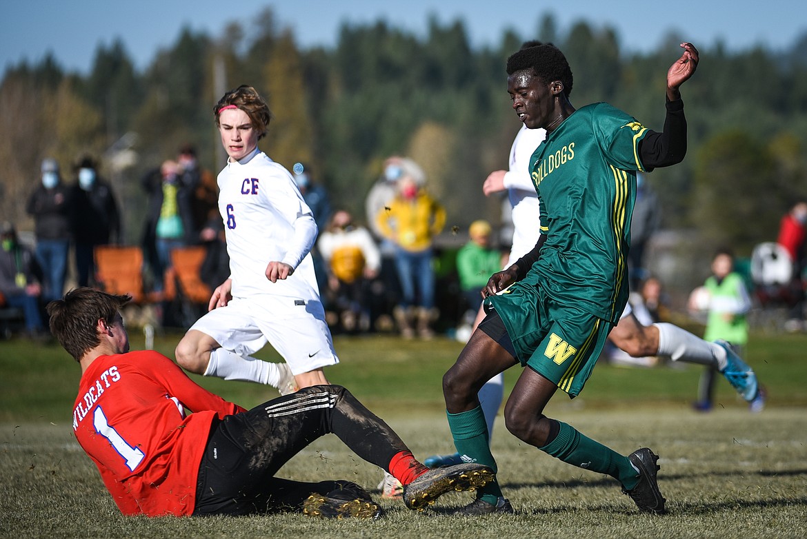 Whitefish's Marvin Kimera (22) has a scoring attempt stopped by Columbia Falls keeper Bryce Dunham (1) in the first half of the Class A boys soccer championship at Smith Fields in Whitefish on Saturday. (Casey Kreider/Daily Inter Lake)