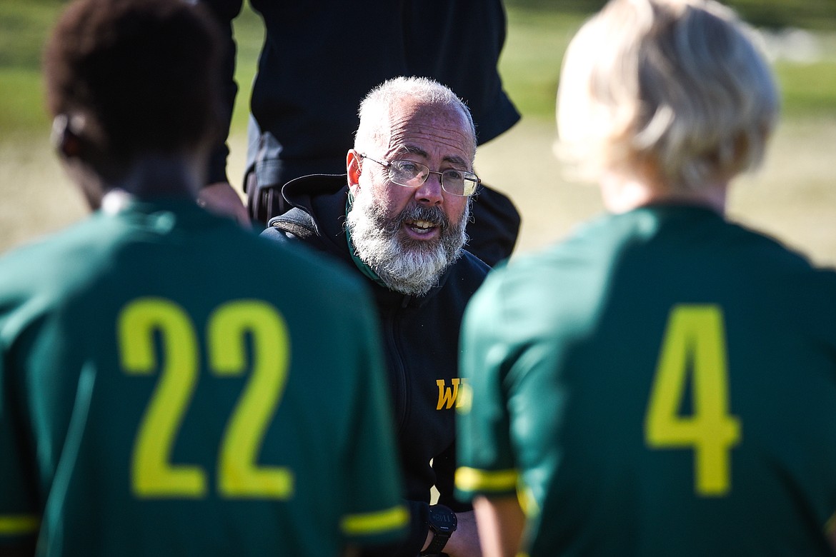 Whitefish head coach John Lacey speaks to the Bulldogs during the half as they faced Columbia Falls in the Class A boys soccer championship at Smith Fields in Whitefish on Saturday. (Casey Kreider/Daily Inter Lake)