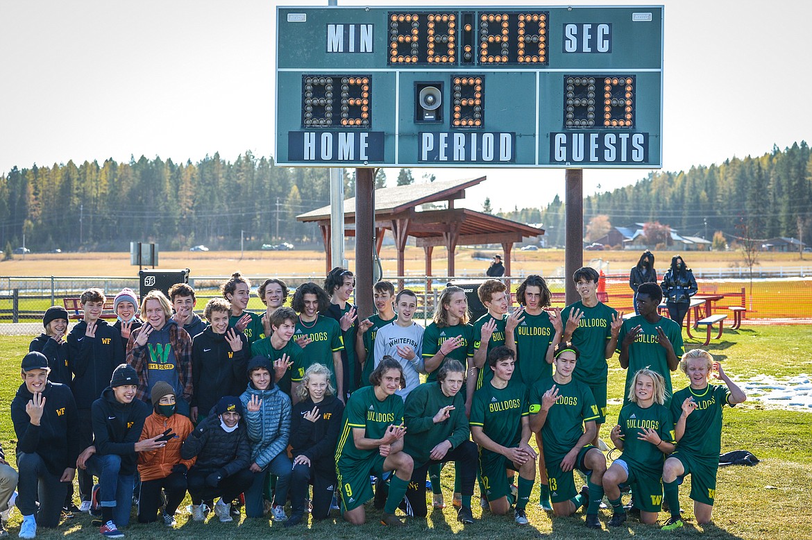 Whitefish poses under the scoreboard after defeating Columbia Falls 3-0 in the Class A boys soccer championship at Smith Fields in Whitefish on Saturday. (Casey Kreider/Daily Inter Lake)