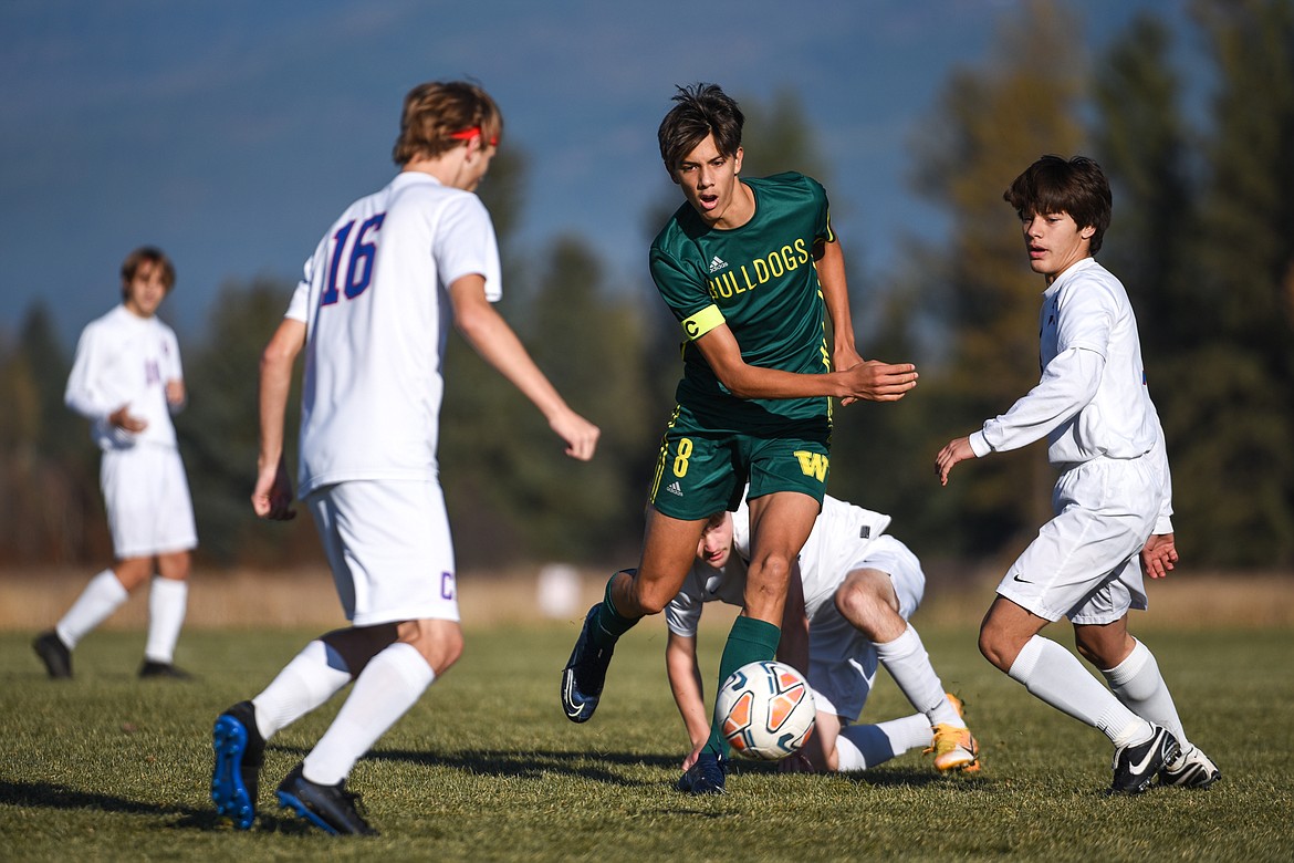 Whitefish's Brandon Mendoza (8) pushes the ball upfield against Columbia Falls during the first half of the Class A boys soccer championship at Smith Fields in Whitefish on Saturday. (Casey Kreider/Daily Inter Lake)