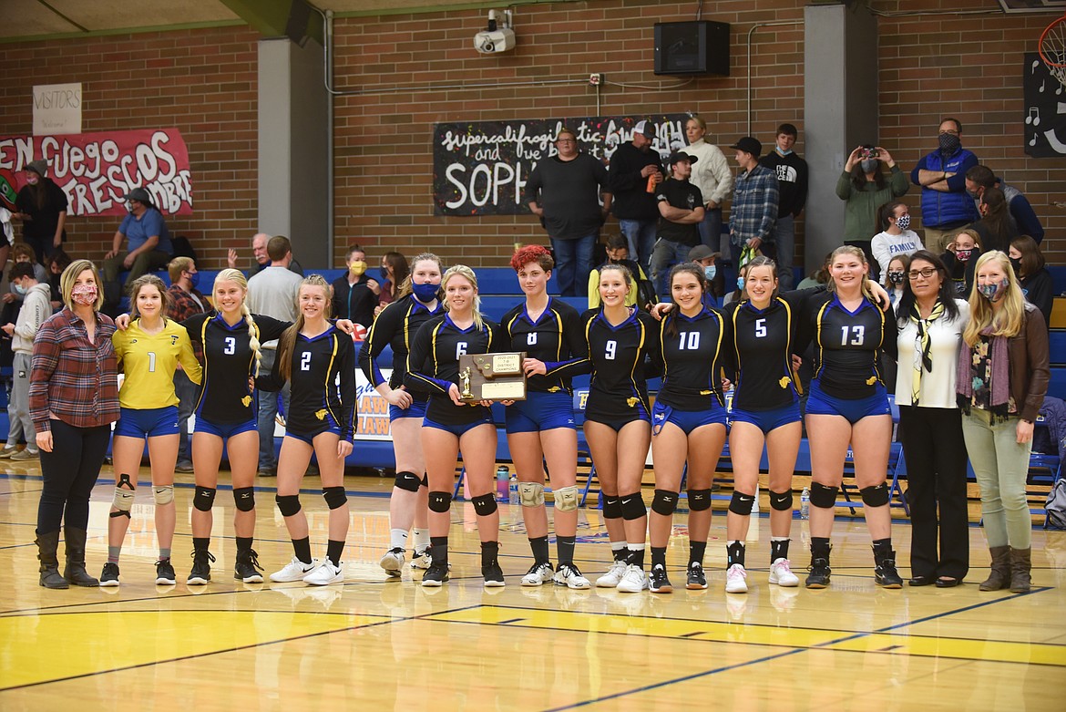 The Thompson Falls Lady Hawks volleyball team shows off its District 7B title after beating Eureka last Friday. (Scott Shindledecker/Valley Press)