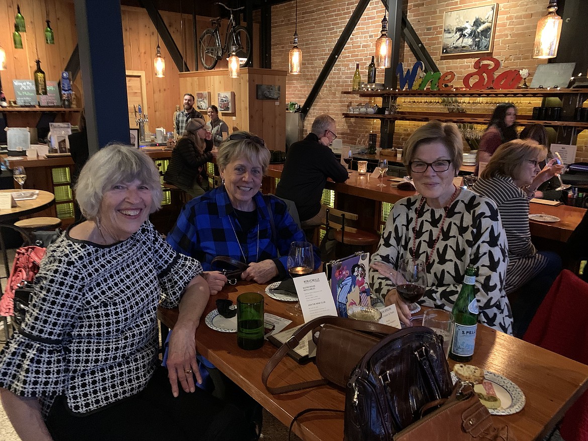 A trio of shoppers take a moment to catch up at North Idaho CASA's Purse Party fundraiser in 2019. This year's event will take place Thursday, Nov. 19 from 4-7 p.m., at the Pend d’Oreille Winery in Sandpoint.