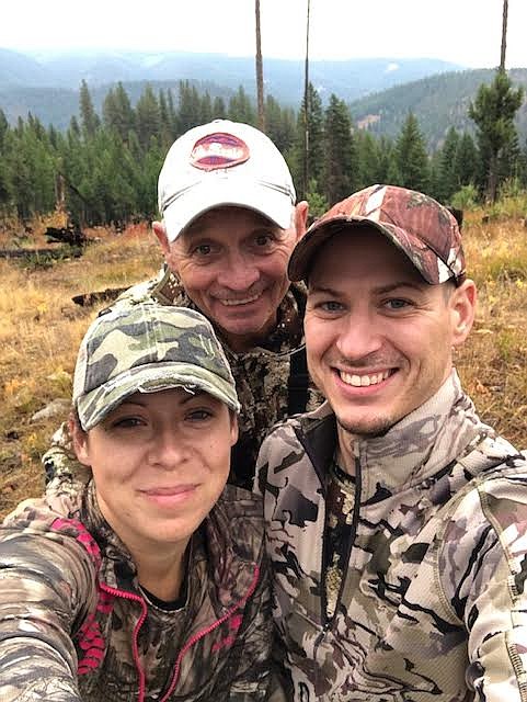 Amy Quinlivan, Mike Hinton, and Christopher Quinlivan on an evening elk hunt Sept. 19. After reaching a ridge top they stopped for a jerky and protein bar dinner while taking in beautiful views. (Amy Quinlivan/Mineral Independent)