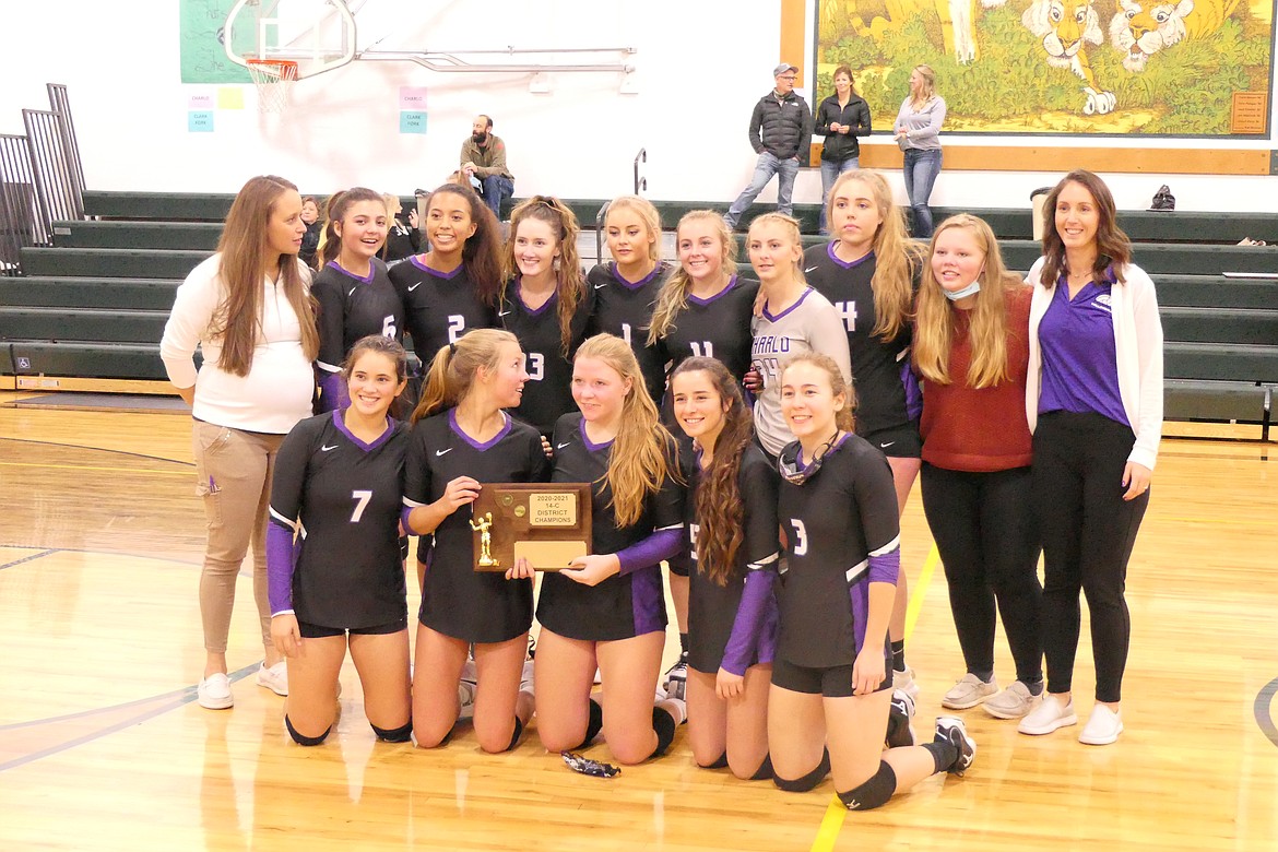 The Charlo Lady Vikings display the championship plaque after winning the District 14C title last week in St. Regis. (Chuck Bandel/Valley Press)