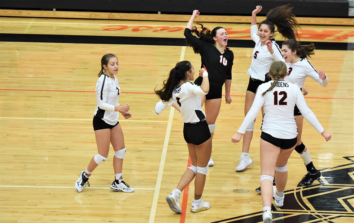 The Maidens celebrate after winning a point against Libby on Friday. (Scot Heisel/Lake County Leader)