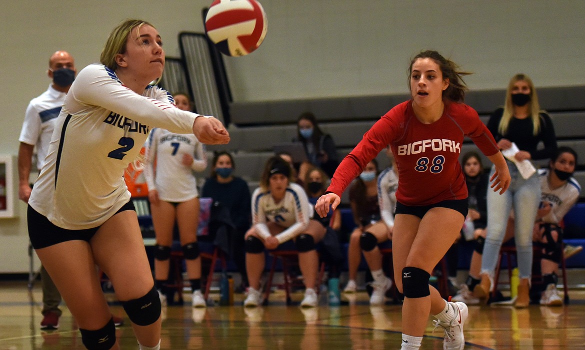 Keyera Mauro lunges for the ball in front of teammate Allie Reichner.
Jeremy Weber
