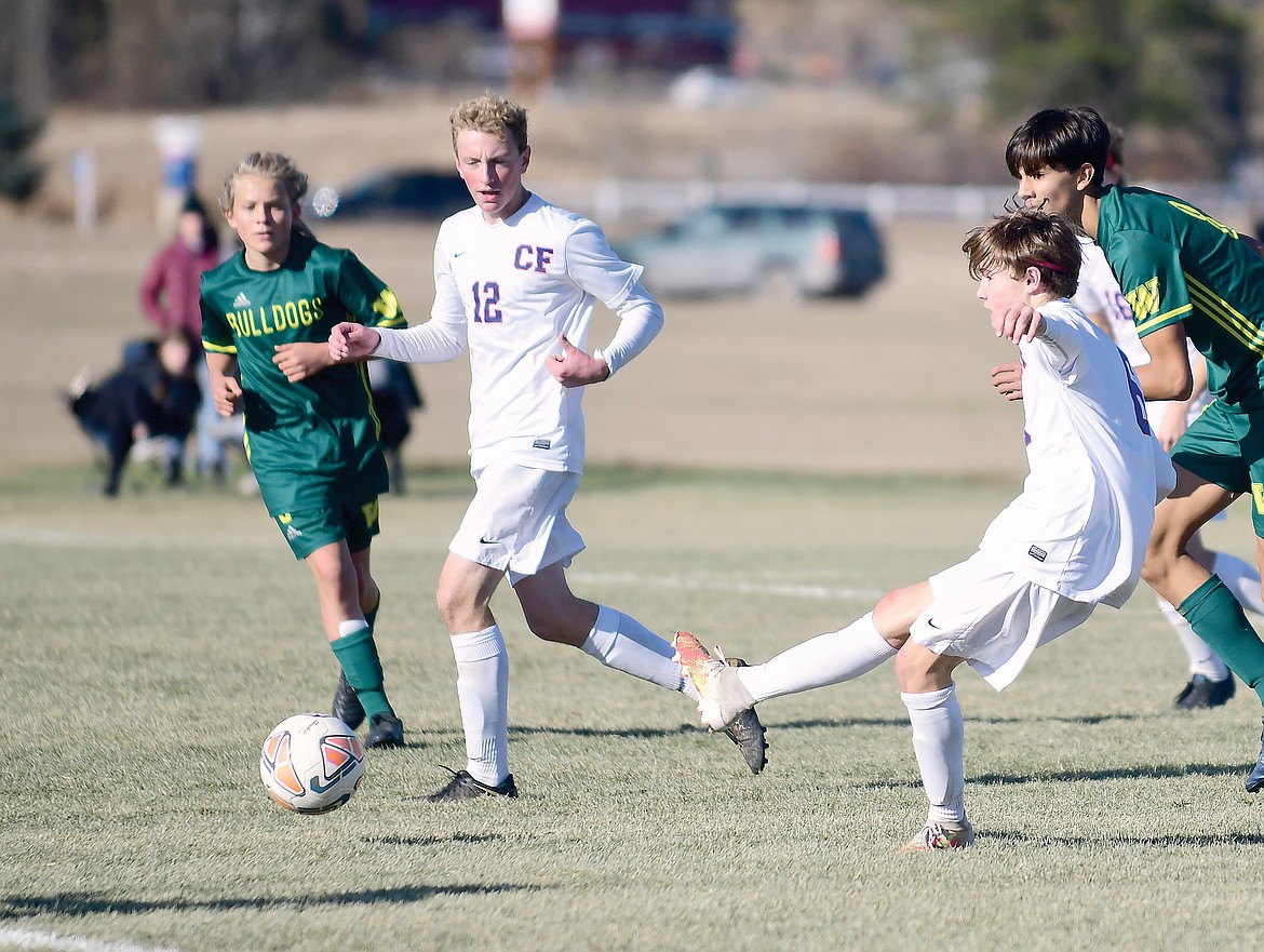 Dale Blickhan clears the ball on defense in the championship on Saturday. (Teresa Byrd/Hungry Horse News)