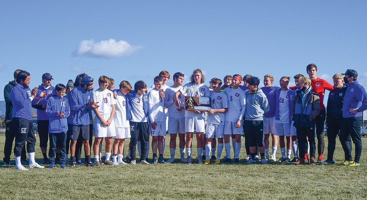 Niels Getts holds the Wildcats' second place trophy after Saturday's Class A State Championship game. (Teresa Byrd/Hungry Horse News)