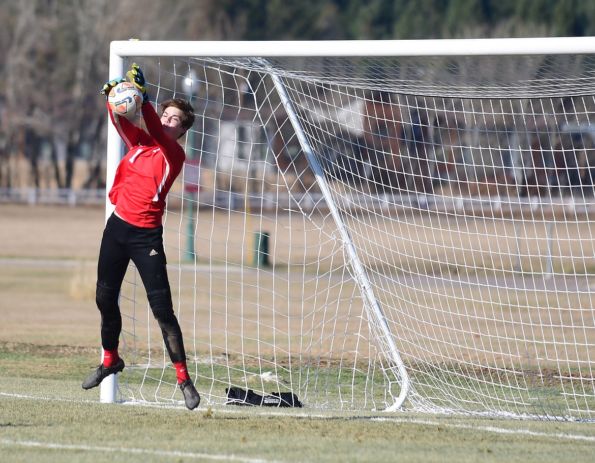 Wildcat goalkeeper Bryce Dunham with a save during Saturday's state final match. (Teresa Byrd/Hungry Horse News)