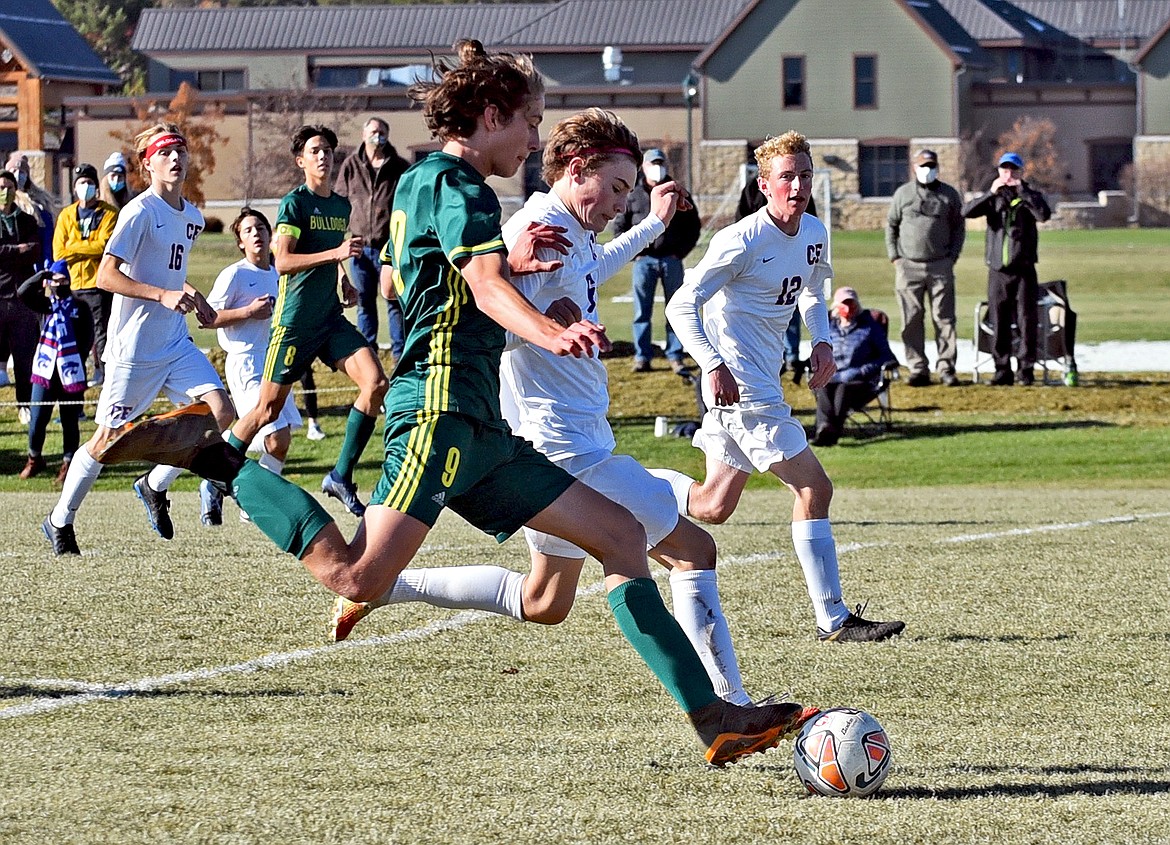 Whitefish's Gabe Menicke winds up ans scores in the second half of the Class A boys soccer championship Saturday. (Whitney England/Whitefish Pilot)