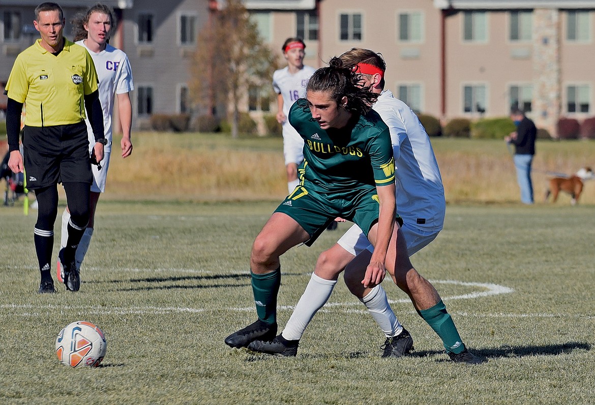 Bulldog senior James Thompson beats the Wildcats to the ball in the Class A state final Saturday at Smith Fields. (Whitney England/Whitefish Pilot)